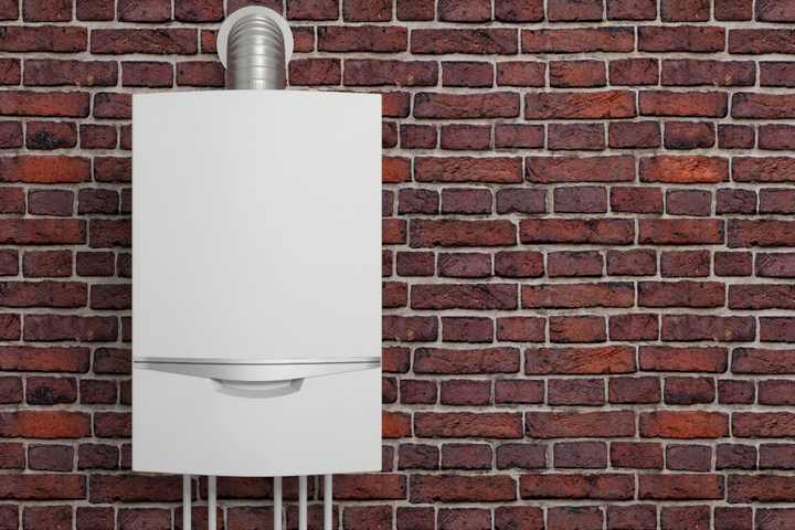 Boiler mounted on a brick wall.