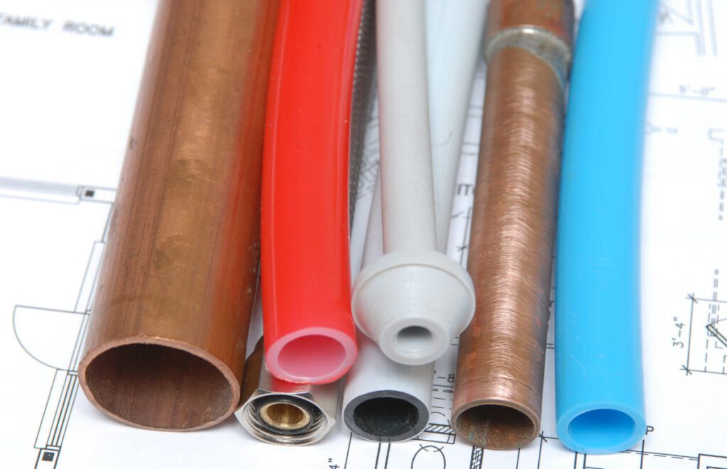 Plumbing pipes in a variety of materials and colours.